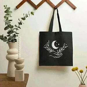 Moon in hand  boho  black and white recycled tote bag